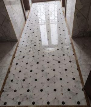 flooring in calacatta with black & onyx inserts